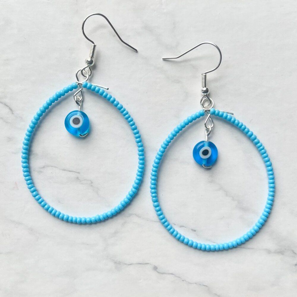 Filled Sky Blue Tear Drop Earrings w/ Hanging Worry Bead Charm